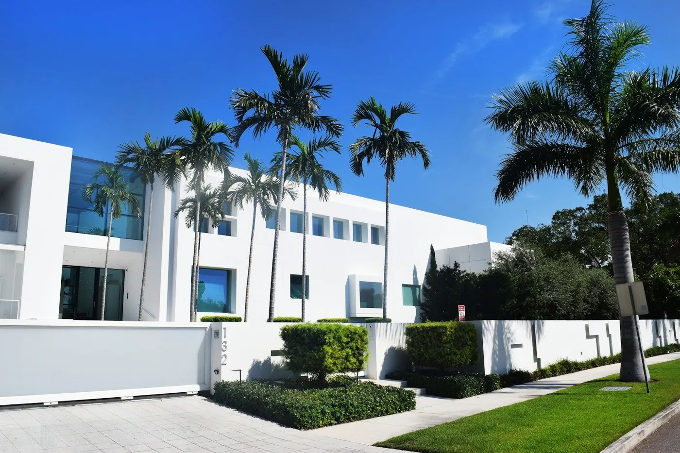Palm trees and a bright Florida sky seen through a large window