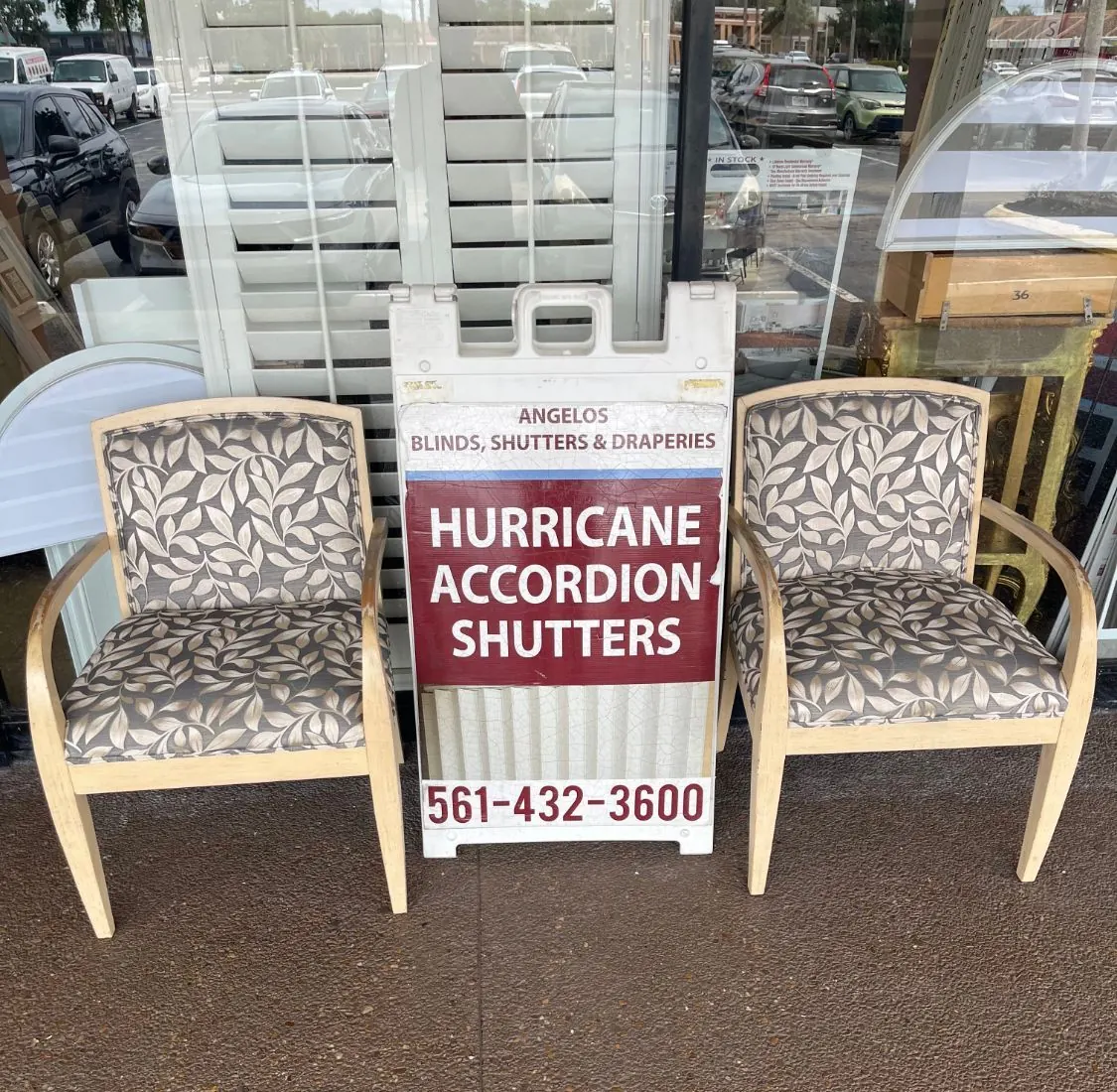 Angelo's hurricane accordion shutters sign outside the Lake Worth Rd showroom