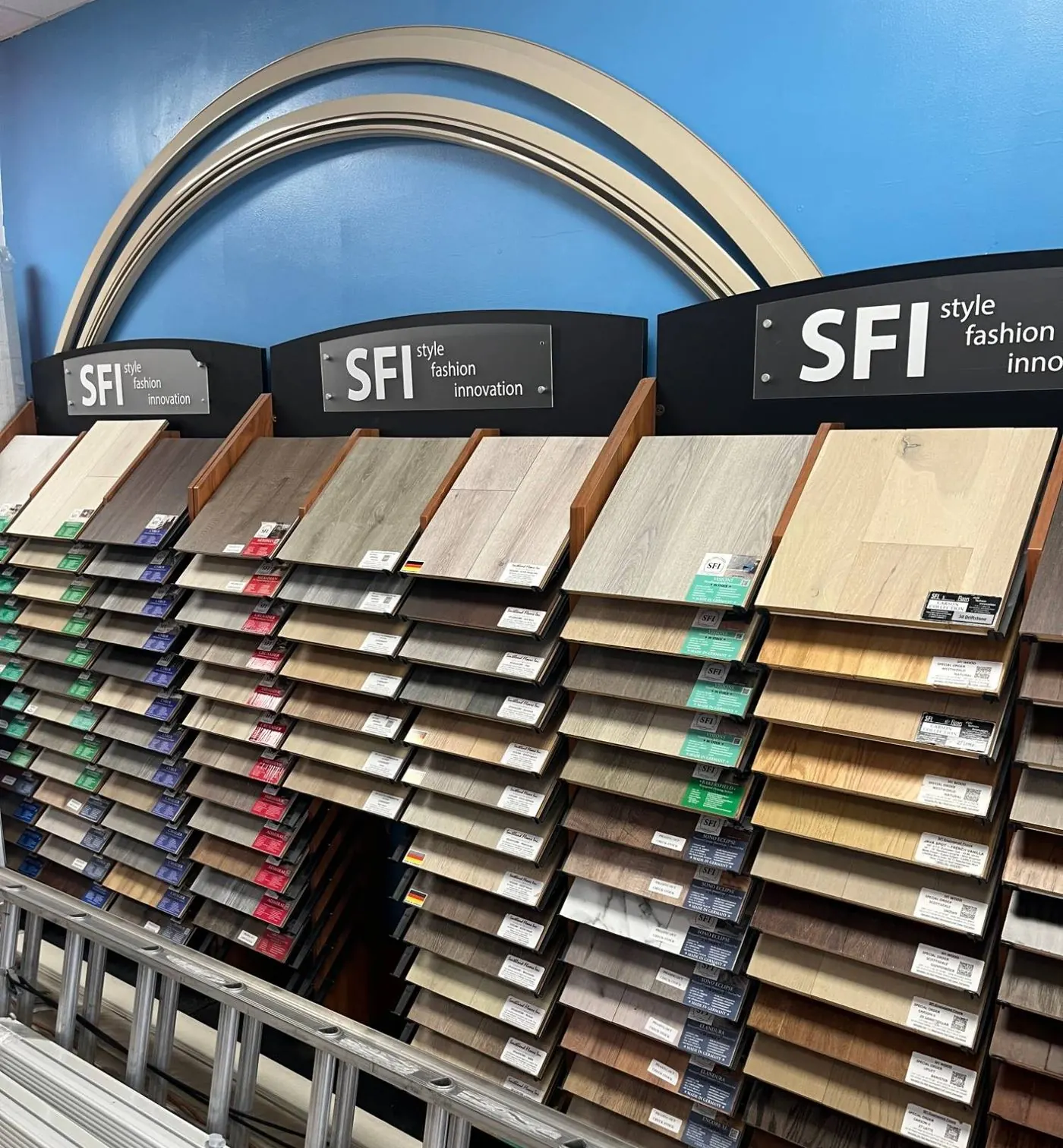 Wall of wood-look flooring samples in the Angelo's showroom