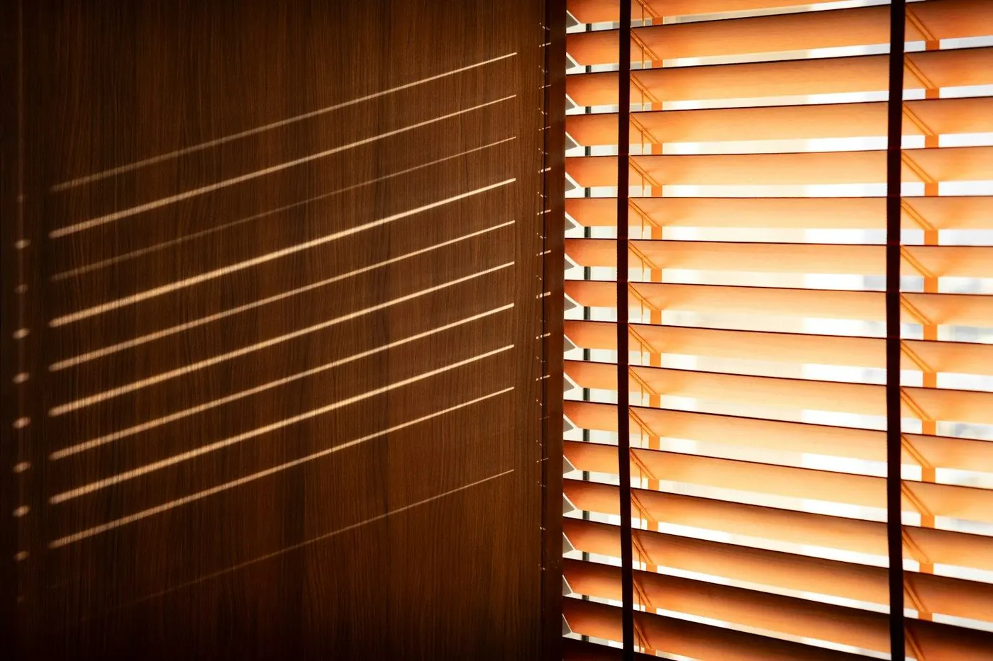 Wood blinds with warm sunlight coming through